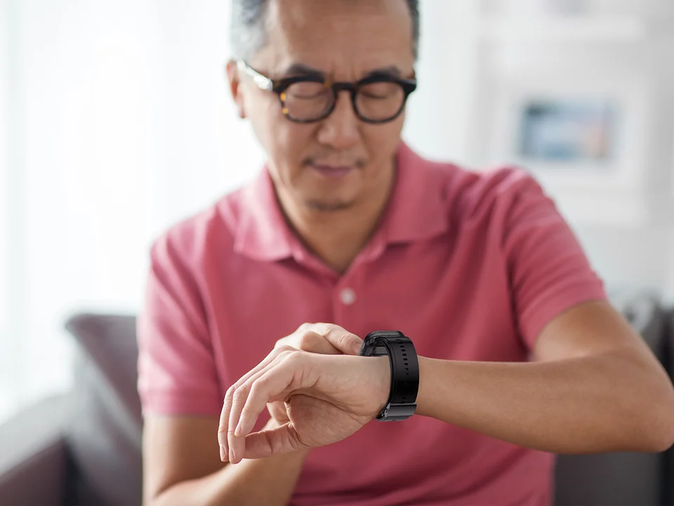 Employee checking a connected health wearable