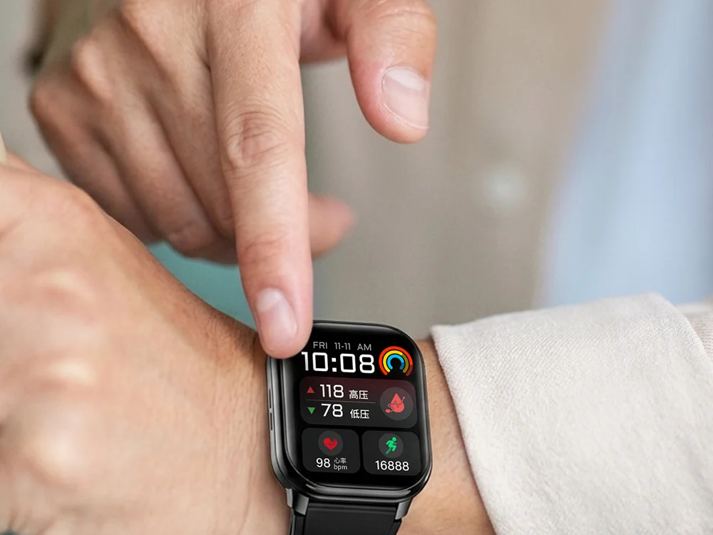 Close-up of a person operating a wrist-worn health watch
