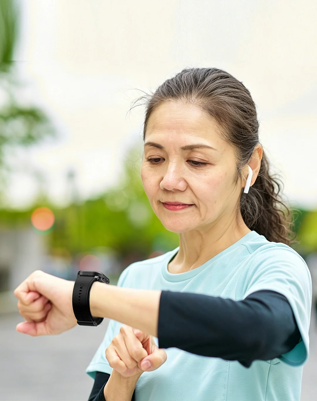 Woman checking a health watch during an everyday outdoor routine
